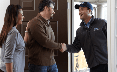 Service technician speaks with homeowner