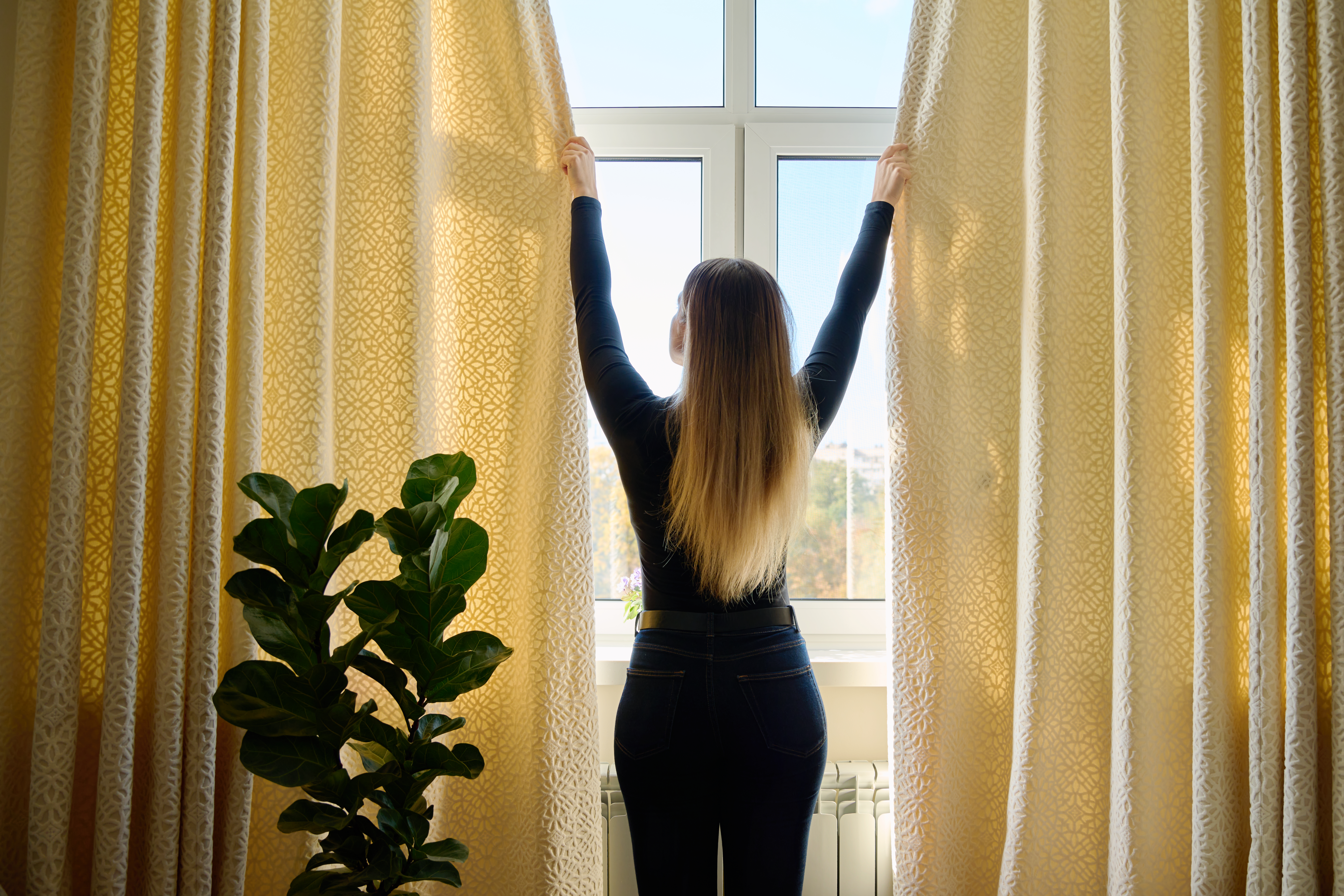 AC technician checks a home's outdoor AC unit.