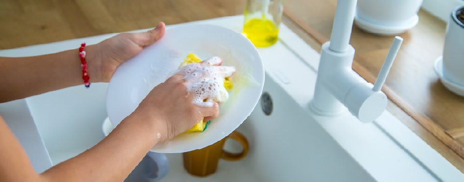Washing dishes after plumbing services 